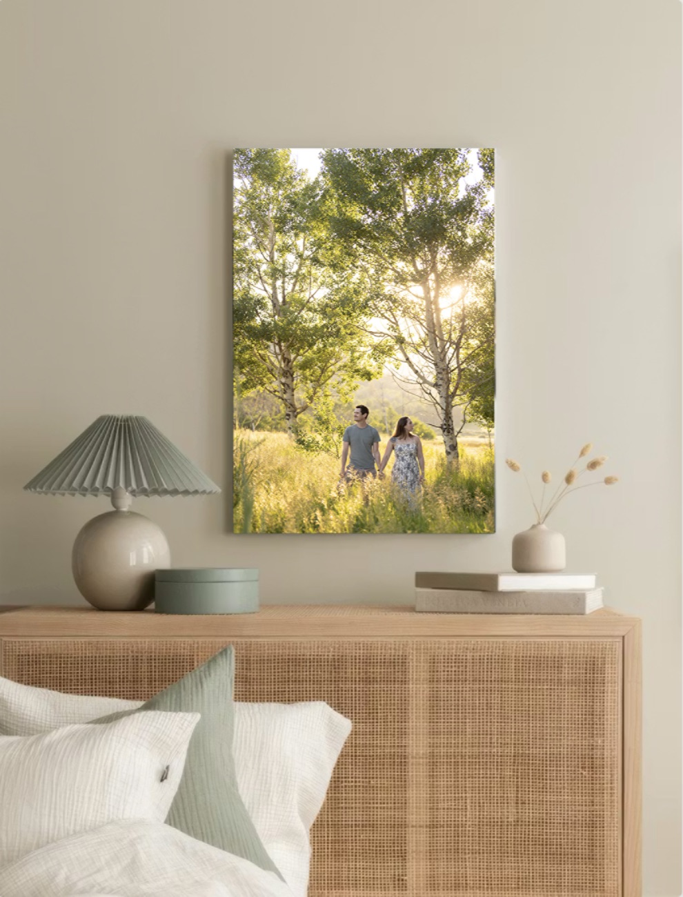 A framed family photograph hanging above a sideboard